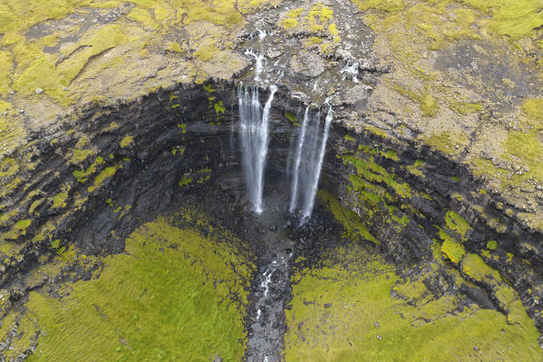 aerial view taken by drone of Fossadalur waterfall during an autumn day, Faroe island, Denmark, Europe