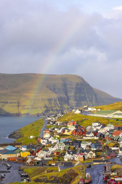 a little village called Eidi under a big rainbow during an autumn day, Eysturoy, Faroe Islands, Denmark, Scandinavia, Europe