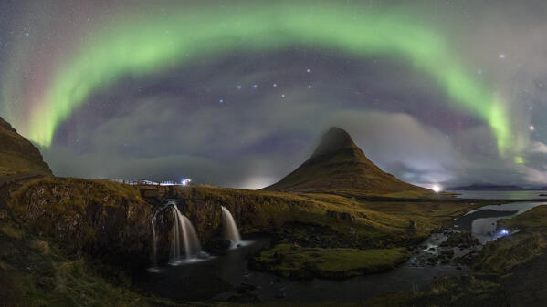 the Northern Lights over iconic Kirkjufell mountain during an autumn night, Grundafjordur, Iceland, Europe