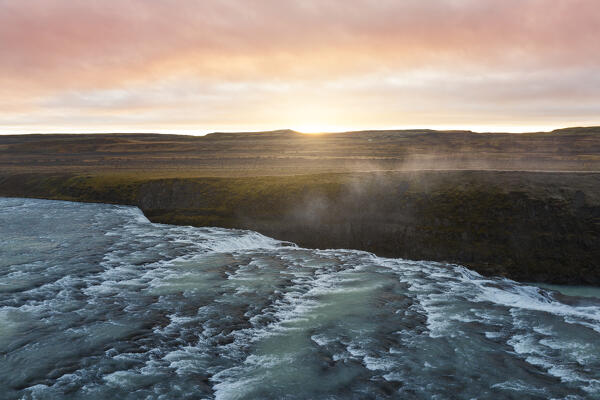 aerial view taken by drone of the Gullfoss waterfall during an autumn sunrise, Iceland, Europe