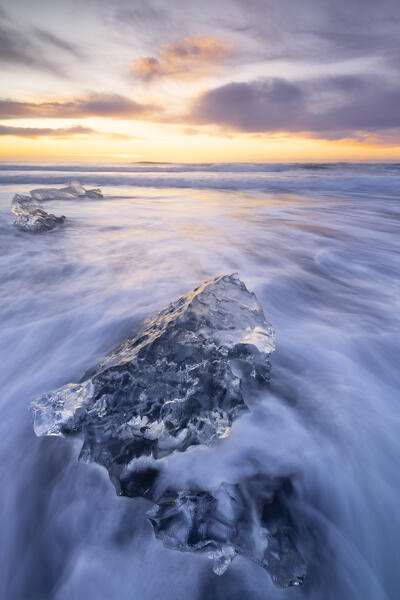 the ice blocks of the famous Black Sand Beach, taken during an autumn sunrise, Jokusarloon, Iceland, Europe