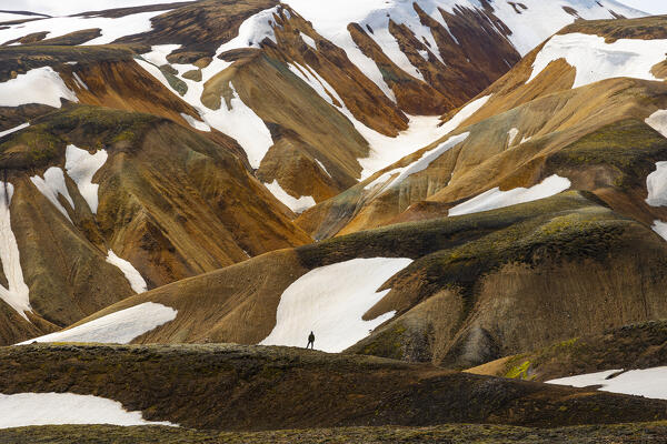 one person enjoy the beautiful landscape in Landmannaugar area during a summer day, Iceland, Europe