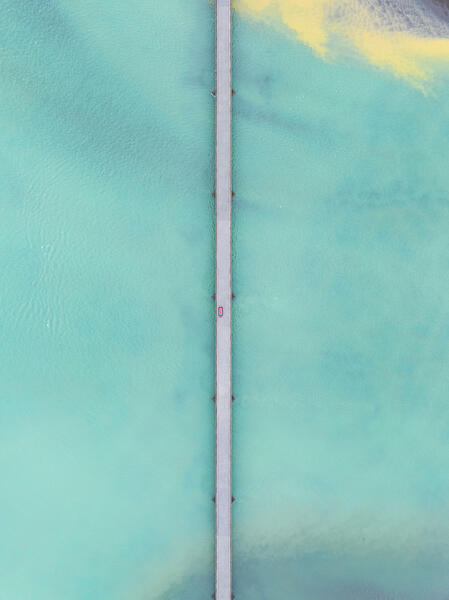 the road crosses a turquoise colored river, southern coast, Iceland, Europe