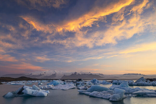 a beautiful summer sunset at Jokusarloon glacier Lagoon with many iceberg in the bay, Iceland, Europe