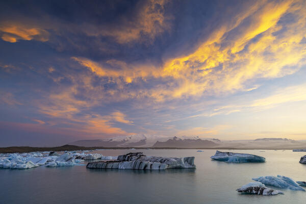 a beautiful summer sunset at Jokusarloon glacier Lagoon with many iceberg in the bay, Iceland, Europe