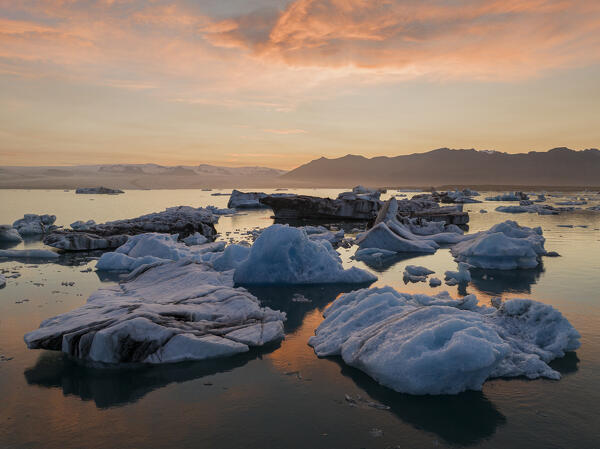 a beautiful summer sunset at Jokusarloon glacier Lagoon with many iceberg in the bay, Iceland, Europe