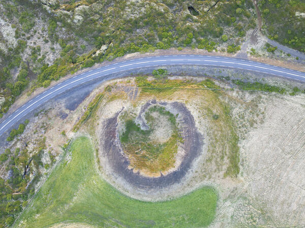 aerial vertical view of old volcano and ashpalt road, near to Myvatn lake during a summer day, Iceland, Europe