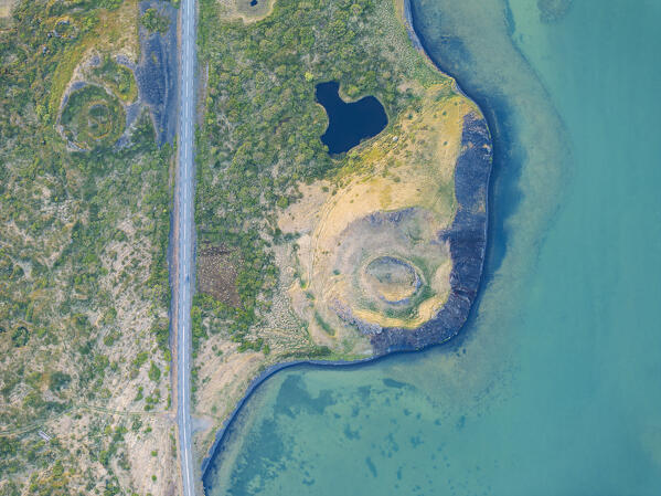 aerial vertical view of old volcano and ashpalt road, near to Myvatn lake during a summer day, Iceland, Europe