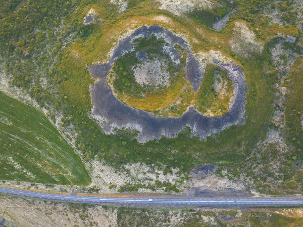 aerial vertical view of old volcano and ashpalt road, near to Myvatn lake during a summer day, Iceland, Europe