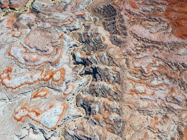 aerial abstract view taken by drone of desert area near to Goblin Valley National Park during a sunny summer day, Utah, United States of America
