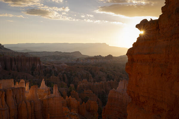 the sunlight envelope the canyons of Bryce Canyon National Park during a summer sunrise, Utah, United States of America