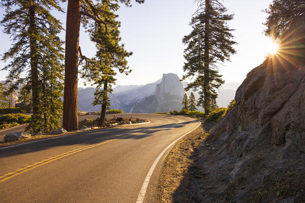 a beautiful sunrise in Yosemite National Park with Half Dome mountain in the foreground, California, United States of America