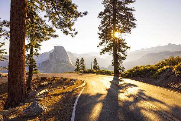 a beautiful sunrise in Yosemite National Park with Half Dome mountain in the foreground, California, United States of America