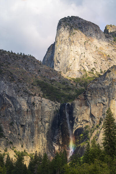 a rainbow waterfall  in Yosemite National Park, California, United States of America