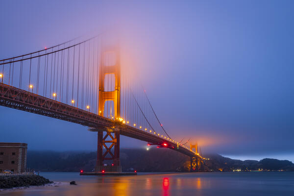 the beautiful Golden Gate Bridge illuminated by lights during the blue hour, San Francisco, California, United States of America