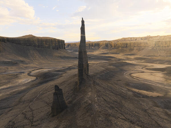 aerial view taken by drone of iconic rock formation called Long Dong Silver Spire during a sunny summer day, Utah, United States of America