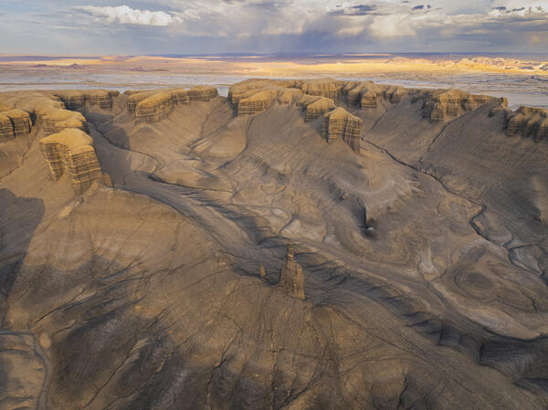 aerial view taken by drone of iconic rock formation called Long Dong Silver Spire during a sunny summer day, Utah, United States of America