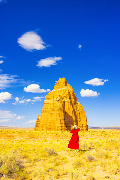 a girl enjoy the beautiful view of the Temple of the Sun on the Capitol Reef National Park during a sunny summer day, Utah, United States of America