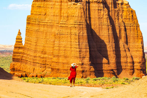 a girl enjoy the beautiful view of the Temple of the Sun on the Capitol Reef National Park during a sunny summer day, Utah, United States of America