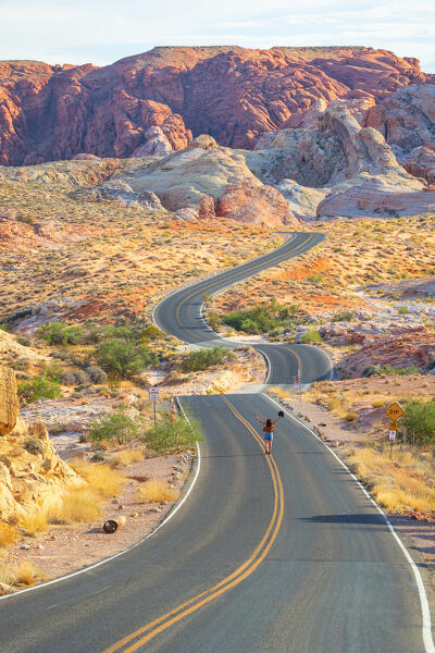 a girl admire the beautiful landscape in Valley of Fire State Park, during a summer day, Nevada, United State of America (MR)