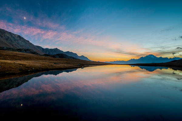 pink sunset in the lake of campagneda, malenco valley, ombardy, italy, europe