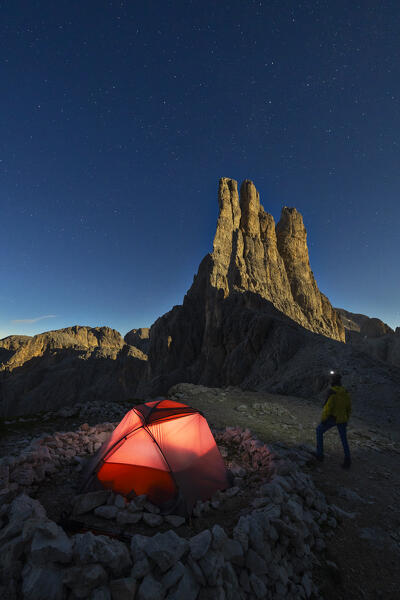 A man with his tent at Vajolet Tower during night, Gruppo del Catinaccio, Dolomiti di Gardena, Bolzano, Trentino Alto Adige, Italy, Southern Europe