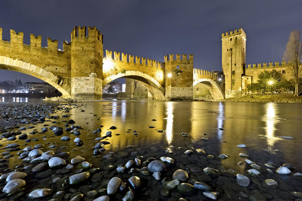 The Castelvecchio and the Scaligero bridge reflected in the Adige river. Verona, Veneto, Italy, Europe.