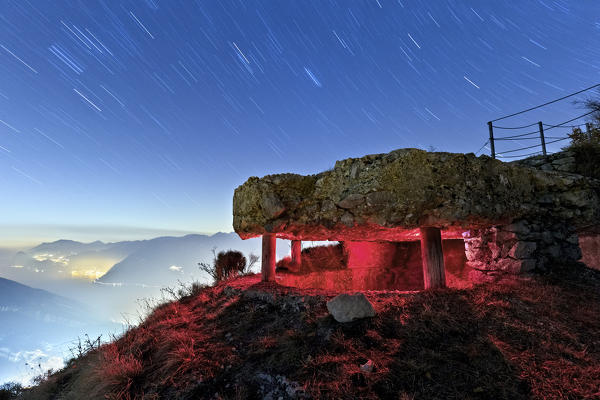 Night at Mount Creino: the Austro-Hungarian observation post of the Great War overlooks the Lake Garda. Gresta Valley, Trento province, Trentino Alto-Adige, Italy, Europe.