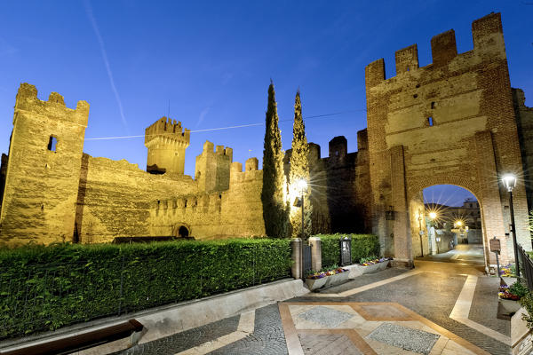 Lazise on Lake Garda: the Scaligero castle and the walk towards the old part of the town. Verona province, Veneto, Italy, Europe.