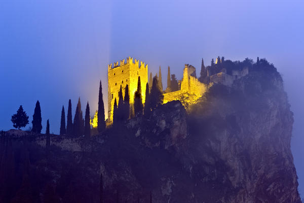 The castle of Arco is perched on a steep cliff overlooking the Alto Garda. Trento province, Trentino Alto-Adige, Italy, Europe.