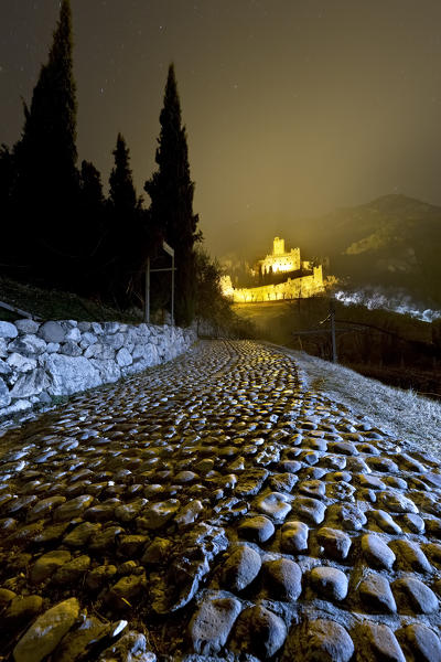 The path to the medieval castle of Avio. Trento province, Trentino Alto-Adige, Italy, Europe.