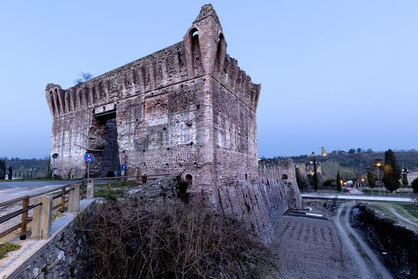 The entrance to the Visconti bridge. In the background the Scaligero castle of Valeggio sul Mincio. Verona province, Veneto, Italy, Europe.