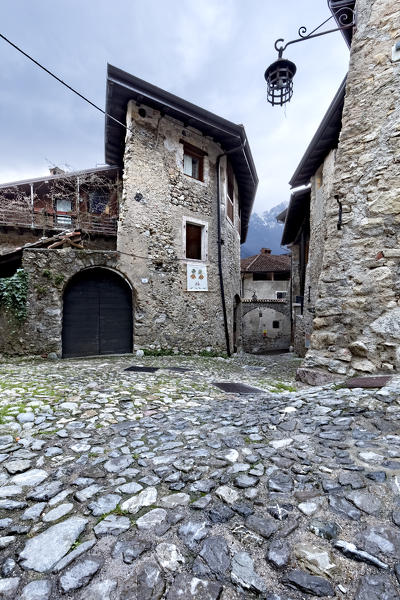 Houses and streets of the medieval village of Canale di Tenno. Trento province, Trentino Alto-Adige, Italy, Europe.