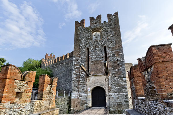 The San Giorgio gate with the drawbridge is the entrance to the medieval castle of Soave. Verona province, Veneto, Italy, Europe. 