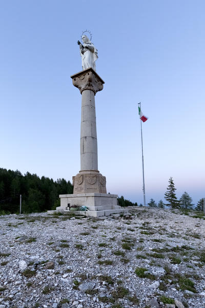 The statue of the Madonna with her eyes turned to the Great War battlefield of Mount Ortigara. Asiago plateau, Vicenza province, Veneto, Italy, Europe.