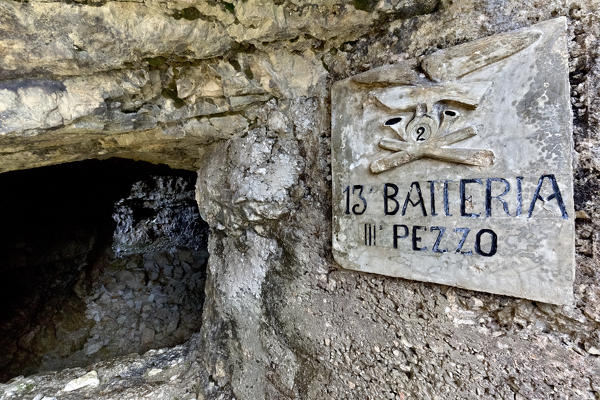 Italian artillery plaque of the Great War at Mount Lozze. Today it is part of the monumental area of mount Ortigara. Asiago plateau, Vicenza province, Veneto, Italy, Europe.