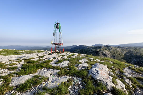 The bell on the top of Mount Ortigara remembers the bloody battles of the Great War. Asiago plateau, Vicenza province, Veneto, Italy, Europe.