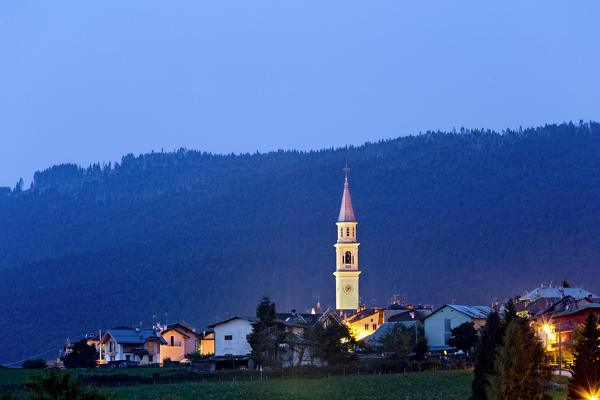 The bell tower of the church of Camporovere on the Asiago plateau. Vicenza province, Veneto, Italy, Europe.