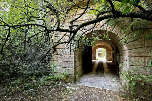 The entrance to Fort Hlawaty is hidden by vegetation. Ceraino, Verona province, Veneto, Italy, Europe.