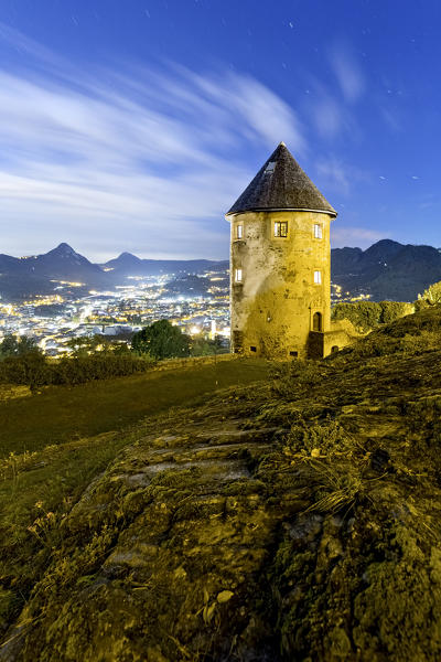 The cylindrical tower of the castle of Pergine dominates the town. Trento province, Trentino Alto-Adige, Italy, Europe.