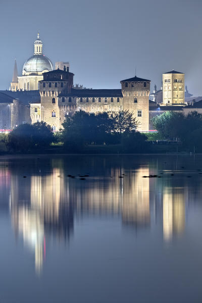 Mantova: the San Giorgio castle is reflected on the middle lake of the Mincio river. The city has been included in the list of UNESCO World Heritage Sites. Lombardy, Italy, Europe.