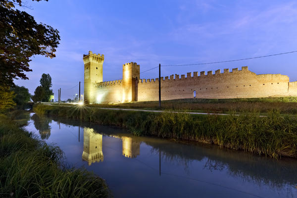 The Scaliger castle of Villimpenta is reflected in the channel of the Tione stream. Villimpenta, Mantova province, Lombardy, Italy, Europe.