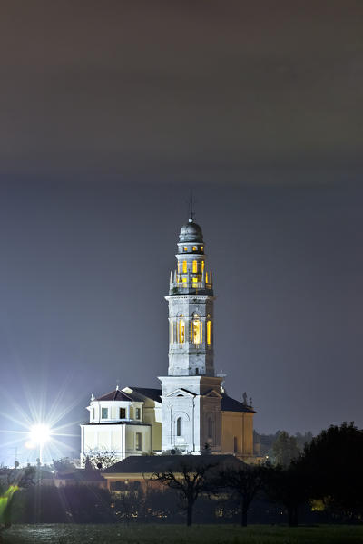 Night at the Cathedral of San Lorenzo Martire in Pescantina. Verona province, Veneto, Italy, Europe.