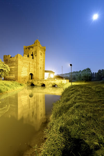 The Scaliger tower of Isola della Scala on a full moon night. Verona province, Veneto, Italy, Europe.