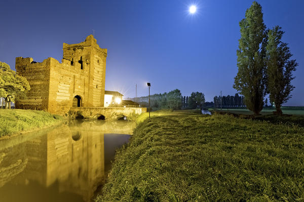 Night falls on the Scaliger tower of Isola della Scala. Verona province, Veneto, Italy, Europe.