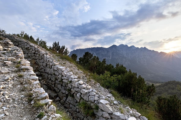 Italian trench of the Great War at the top of Mount La Sisilla. In the background the Carega ridge. Piccole Dolomiti, Recoaro Terme, Vicenza province, Veneto, Italy, Europe.