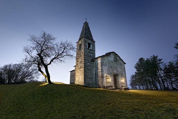 Night at the medieval church of Santa Apollonia in Manzano. Gresta Valley, Trento province, Trentino Alto-Adige, Italy, Europe.