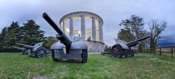 The four Ansaldo 105/28 cannons of the Battisti Battery and the mausoleum of Cesare Battisti. Doss Trento, Trento, Trentino Alto-Adige, Italy, Europe. 