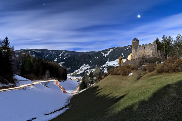 Full moon night over Reinegg castle. Sarentine Alps, Bolzano province, Trentino Alto-Adige, Italy, Europe. 