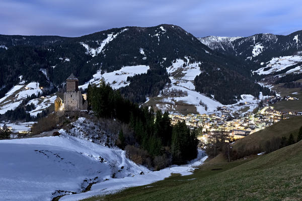 Full moon night over Reinegg castle and Sarentino valley. Bolzano province, Trentino Alto-Adige, Italy, Europe. 